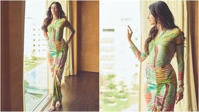 Another promotional look of Ananya that left the internet abuzz showed the star in a coordinated tropical printed bodysuit and a bodycon skirt. She chose OTT accessories to style the ensemble, including dangling earrings, statement bracelets, and peep-toe sandals. (Instagram) Another promotional look of Ananya that left the internet abuzz showed the star in a coordinated tropical printed bodysuit and a bodycon skirt. She chose OTT accessories to style the ensemble, including dangling earrings, statement bracelets, and peep-toe sandals. (Instagram)