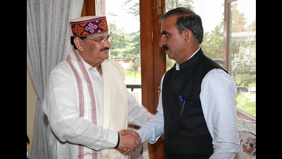 Bharatiya Janata Party (BJP) national president JP Nadda exchanges greetings with Himachal Pradesh chief minister Sukhvinder Singh Sukhu during a meeting regarding the loss of lives and damage caused by the natural calamity in the state, in Shimla on Sunday. (ANI)