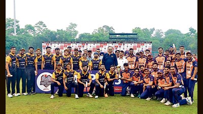 Leisure Zone and Rock Zone players with the UTCA T20 League trophy after being declared as joint winners in Chandigarh on Sunday. (HT Photo)