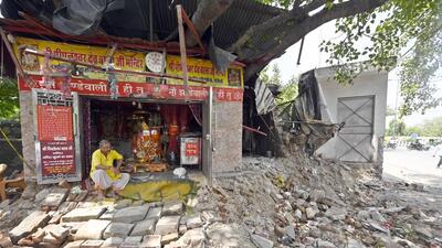 PWD demolishes encroachments outside Peepleshwar Temple at Jahndewalan in New Delhi on Sunday. (Sanjeev Verma/HT Photo) PWD demolishes encroachments outside Peepleshwar Temple at Jahndewalan in New Delhi on Sunday. (Sanjeev Verma/HT Photo)