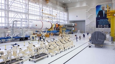 The photograph released by the Russian Space Agency Roscosmos on August 7 shows technicians finishing assembling a Soyuz 2.1b rocket carrying the Luna-25 lander ahead of its launch scheduled for August 11. (Roscosmos via AFP) The photograph released by the Russian Space Agency Roscosmos on August 7 shows technicians finishing assembling a Soyuz 2.1b rocket carrying the Luna-25 lander ahead of its launch scheduled for August 11. (Roscosmos via AFP)