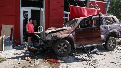 Russia-Ukraine War: A local resident stands next to a damaged car at the site of a missile strike in Chernihiv. (AFP) Russia-Ukraine War: A local resident stands next to a damaged car at the site of a missile strike in Chernihiv. (AFP)
