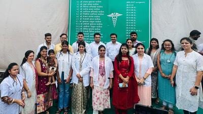 The doctors of Gharivali pose before a hoarding with all their names, which is prominently displayed in the village. (HT Photo) The doctors of Gharivali pose before a hoarding with all their names, which is prominently displayed in the village. (HT Photo)