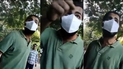 In a video, the man wearing a mask can be seen warning the cops of stern action.