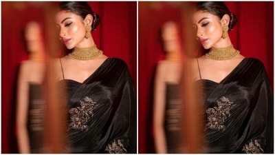Mouni looked gorgeous in the saree decorated in golden resham threads. She teamed it with a matching black slip blouse with ruched details. (Instagram/@imouniroy) Mouni looked gorgeous in the saree decorated in golden resham threads. She teamed it with a matching black slip blouse with ruched details. (Instagram/@imouniroy)