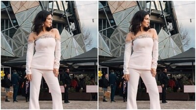 Sunny decked up in a white off-shoulder top with full sleeves, and silver sequin details adorning the neckline. In matching white trousers with wide legs, she completed her look. (Instagram/@sunnyleone) Sunny decked up in a white off-shoulder top with full sleeves, and silver sequin details adorning the neckline. In matching white trousers with wide legs, she completed her look. (Instagram/@sunnyleone)