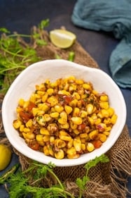 Indulge in the rich flavors of Buttery Corn Chaat, a harmonious blend of succulent corn kernels and aromatic spices. (Pinterest) Indulge in the rich flavors of Buttery Corn Chaat, a harmonious blend of succulent corn kernels and aromatic spices. (Pinterest)