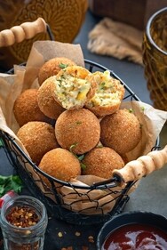 Experience a burst of flavours with Crispy Corn Cheese Balls – a perfect fusion of crunch and creaminess. (Pinterest) Experience a burst of flavours with Crispy Corn Cheese Balls – a perfect fusion of crunch and creaminess. (Pinterest)