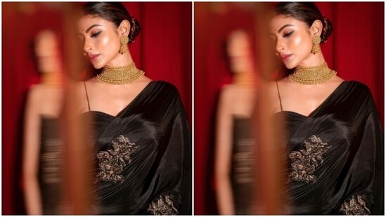 Mouni looked gorgeous in the saree decorated in golden resham threads. She teamed it with a matching black slip blouse with ruched details.&nbsp;(Instagram/@imouniroy)
