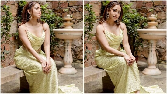 Assisted by fashion stylist Nidhi Jeswani, Nushrratt accessorised her look with a pair of statement gold drop earrings, a green emerald ring on her finger and a pair of nude heels.(Instagram/@nushrrattbharuccha)