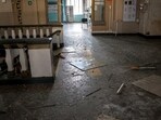 Russia-Ukraine War: Broken glass and debris in a damaged hall of a railway station.