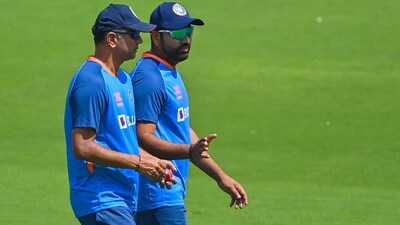 India captain Rohit Sharma speaks with coach Rahul Dravid during a training session (AFP/File Photo)
