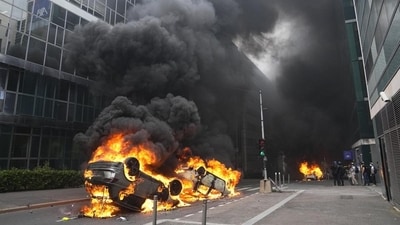 Cars burn after a march for Nahel on Thursday, June 29, 2023 in Nanterre, outside Paris. The killing of 17-year-old Nahel during a traffic check on Tuesday, captured on video, shocked the country and stirred up long-simmering tensions between young people and police in housing projects and other disadvantaged neighbourhoods in France. After more than 3,400 arrests and signs that the violence is now abating, France is once again facing a reckoning. (AP Photo/Michel Euler, File)