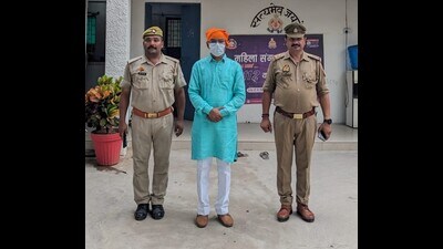 Former SP MLA Brajesh Kumar Prajapati in police custody in Lucknow on August 21. (Sourced)
