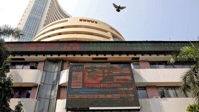 A bird flies past a screen displaying the Sensex results on the facade of the Bombay Stock Exchange (BSE) building in Mumbai. (REUTERS)