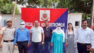 Police with the suspended rape-accused Delhi government official and his wife on Monday. (ANI) Police with the suspended rape-accused Delhi government official and his wife on Monday. (ANI)