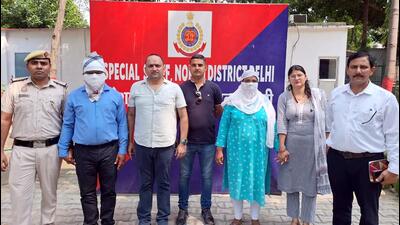Police with the suspended rape-accused Delhi government official and his wife on Monday. (ANI) Police with the suspended rape-accused Delhi government official and his wife on Monday. (ANI)