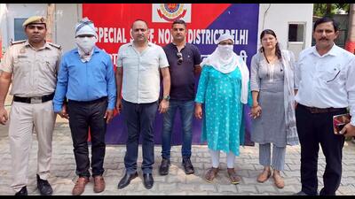 Police with the suspended rape-accused Delhi government official and his wife on Monday. (ANI) Police with the suspended rape-accused Delhi government official and his wife on Monday. (ANI)