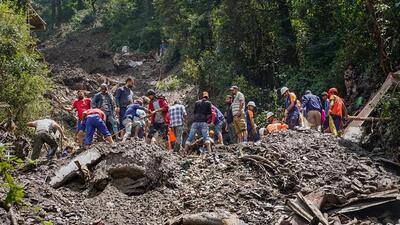Rescue workers removing debris in Shimla on Monday as they search for survivors after torrential rain triggered a landslide in the state capital a week ago. (PTI Photo) Rescue workers removing debris in Shimla on Monday as they search for survivors after torrential rain triggered a landslide in the state capital a week ago. (PTI Photo)