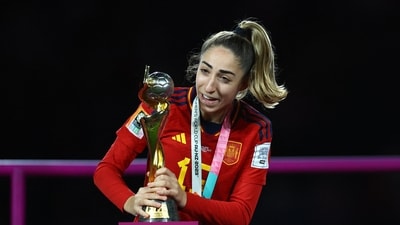 Spain's Olga Carmona celebrate with the trophy after winning the world cup (REUTERS)
