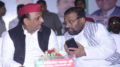 Samajwadi Party chief Akhilesh Yadav with party leader Swami Prasad Maurya at a conclave in Lucknow on Monday. (HT Photo) Samajwadi Party chief Akhilesh Yadav with party leader Swami Prasad Maurya at a conclave in Lucknow on Monday. (HT Photo)
