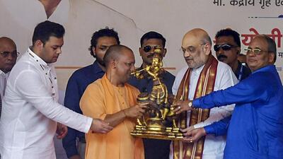 Uttar Pradesh chief minister Yogi Adityanath with Union home minister Amit Shah and others at Kalyan Singh’s second death anniversary function in Aligarh on Monday. (PTI PHOTO)
