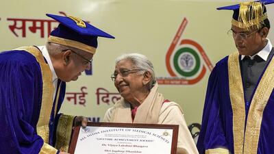 Vice President Jagdeep Dhankhar presents lifetime achievement award to professor Vijaya Lakshmi Bhargava at AIIMS on Monday. (PTI)