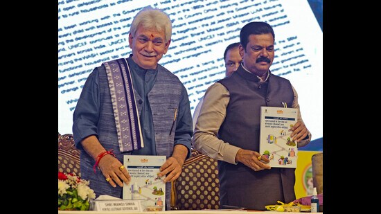 J&K Lt. Governor Manoj Sinha and Union Minister of State for Panchayat Raj Moreshwar Patil launch the 'Meri Panchayat App' during the inauguration of the three-day national workshop on 'Panchayat with Good Governance', at SKICC in Srinagar on Monday. (PTI)