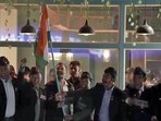 Congress leader Rahul Gandhi holds the national flag with Army veterans at the Main Market of Leh on Monday. Congress leader Rahul Gandhi holds the national flag with Army veterans at the Main Market of Leh on Monday.