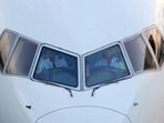 Pilots are seen in the cockpit of an airplane as it sits on the tarmac at John F. Kennedy International Airport on the July 4th weekend in Queens, New York City, U.S., July 2, 2022. REUTERS/Andrew Kelly Pilots are seen in the cockpit of an airplane as it sits on the tarmac at John F. Kennedy International Airport on the July 4th weekend in Queens, New York City, U.S., July 2, 2022. REUTERS/Andrew Kelly