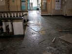 Russia-Ukraine War: Broken glass and debris in a damaged hall of a railway station.