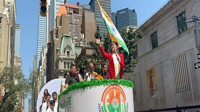 Bollywood actress Jacqueline Fernandez waves to the crowd while holding the National flag as she participates in the India Day parade in New York on Monday. (ANI ) Bollywood actress Jacqueline Fernandez waves to the crowd while holding the National flag as she participates in the India Day parade in New York on Monday. (ANI )