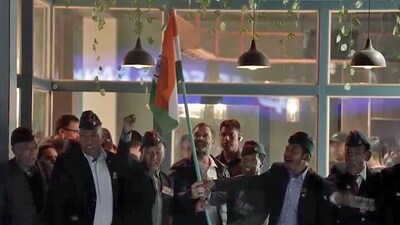 Congress leader Rahul Gandhi holds the national flag with Army veterans at the Main Market of Leh on Monday. Congress leader Rahul Gandhi holds the national flag with Army veterans at the Main Market of Leh on Monday.