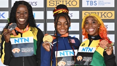 Jamaica's silver medallist Shericka Jackson, USA's gold medallist Sha'Carri Richardson and Jamaica's bronze medallist Shelly-Ann Fraser-Pryce pose during the podium ceremony for the women's 100m during the World Athletics Championships in Budapest (AFP) Jamaica's silver medallist Shericka Jackson, USA's gold medallist Sha'Carri Richardson and Jamaica's bronze medallist Shelly-Ann Fraser-Pryce pose during the podium ceremony for the women's 100m during the World Athletics Championships in Budapest (AFP)