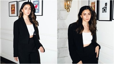 Alia Bhatt stuns in a black pantsuit styled with a crop top and no-makeup look for a photoshoot. (Instagram) Alia Bhatt stuns in a black pantsuit styled with a crop top and no-makeup look for a photoshoot. (Instagram)