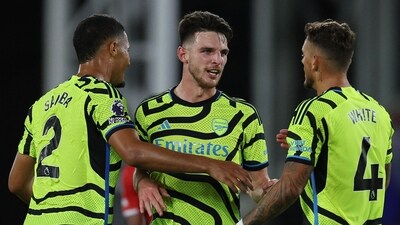 Arsenal's French defender #02 William Saliba (L), English midfielder #41 Declan Rice (C) and defender #04 Ben White celebrate (AFP) Arsenal's French defender #02 William Saliba (L), English midfielder #41 Declan Rice (C) and defender #04 Ben White celebrate (AFP)