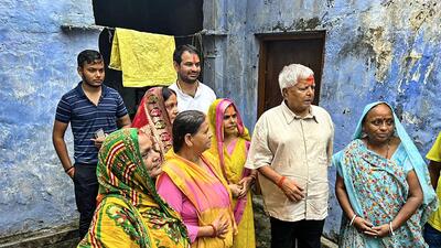 Lalu Prasad with wife Rabri Devi and son Tej Pratap Yadav at his native village in Gopalganj district. (PTI) Lalu Prasad with wife Rabri Devi and son Tej Pratap Yadav at his native village in Gopalganj district. (PTI)
