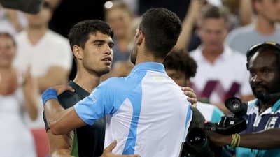 Carlos Alcaraz of Spain congratulates Novak Djokovic of Serbia after their match during the final of the Western & Southern Open at Lindner Family Tennis Center on August 20 (Getty Images via AFP) Carlos Alcaraz of Spain congratulates Novak Djokovic of Serbia after their match during the final of the Western & Southern Open at Lindner Family Tennis Center on August 20 (Getty Images via AFP)