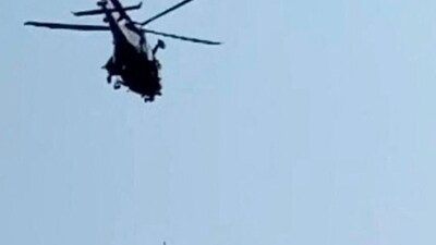 Pakistan Cable Car Rescue: An army soldier slings down from helicopter during the rescue mission. (AFP) Pakistan Cable Car Rescue: An army soldier slings down from helicopter during the rescue mission. (AFP)