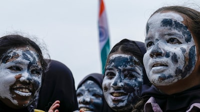 Students of Everwin School with their faces painted with moon celebrate the pre-soft landing of Chandrayaan- 3, in Chennai. (PTI) Students of Everwin School with their faces painted with moon celebrate the pre-soft landing of Chandrayaan- 3, in Chennai. (PTI)