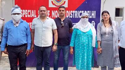 Premoday Khakha and his wife Seema Rani after being arrested by Delhi police. (HT Photo) Premoday Khakha and his wife Seema Rani after being arrested by Delhi police. (HT Photo)