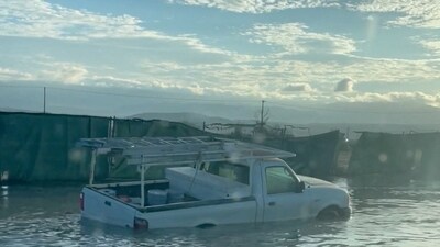 A view of a vehicle on a flooded road in the aftermath of flooding caused by tropical storm Hilary, in Palm Desert, California, U.S., August 21, 2023. (Karen Thomson via REUTERS)