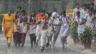 Students enjoy the rains in New Delhi. (PTI Photo/File)