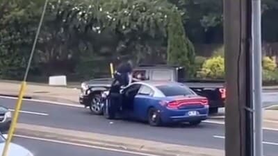 Police chase in Atlanta ends with an officer apprehending a pickup Truck driver who plowed into pedestrians. (Twitter/CitizenFreePres) Police chase in Atlanta ends with an officer apprehending a pickup Truck driver who plowed into pedestrians. (Twitter/CitizenFreePres)
