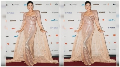 Her strapless gown comes in a golden colour and features intricate crystal embellishment at the top and sequin work all over. She paired it with a matching floor-length cape, which added to the oomph factor. (Instagram/@sunnyleone)