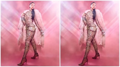 Her catsuit is from the shelves of the fashion brand Nitika Karizma and features multi-coloured shiny embellishments all over. She paired it with a light pink fur jacket to add a little extra flair to her look. (Instagram/@norafatehi) Her catsuit is from the shelves of the fashion brand Nitika Karizma and features multi-coloured shiny embellishments all over. She paired it with a light pink fur jacket to add a little extra flair to her look. (Instagram/@norafatehi)