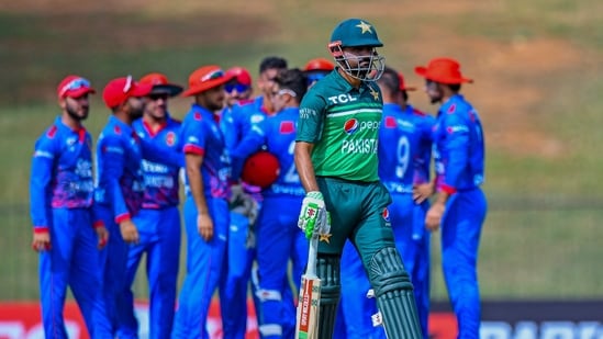 Pakistan's captain Babar Azam walks back to the pavilion after his dismissal during the first one-day international (ODI) cricket match between Pakistan and Afghanistan (AFP)