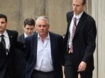 FILE — Former Suffolk County Police Chief James Burke, second from right, is escorted to a vehicle by FBI personnel outside an FBI office, in Melville, N.Y., Dec. 9, 2015. Burke, 58, who served federal prison time for beating a suspect, was arrested Tuesday, Aug. 22, 2023, for allegedly soliciting sex and exposing himself at a public park in Farmingdale, on New York's Long Island. (Steve Pfost/Newsday via AP, File)