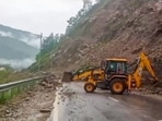 Rudraprayag: Heavy machinery being used to clear Rishikesh-Badrinath National Highway blocked with boulders after a rain-triggered landslide, in Rudraprayag district, Monday, July 24, 2023. (PTI Photo)(PTI07_24_2023_000025B)