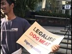 Bengaluru man holding up a placard. Bengaluru man holding up a placard.